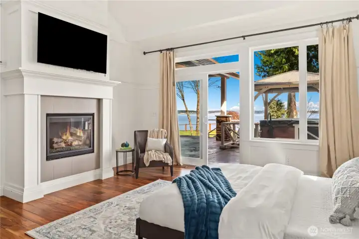 The primary ensuite has a propane fireplace, private access to the covered deck and hot tub, walk-in closet and beautiful 4-piece bath with heated marble floors.