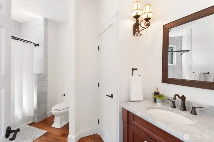 The main level full bathroom is conveniently located next to the guest bedroom.