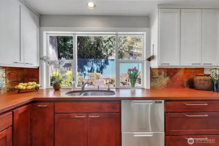 Kitchen looks out to private back yard
