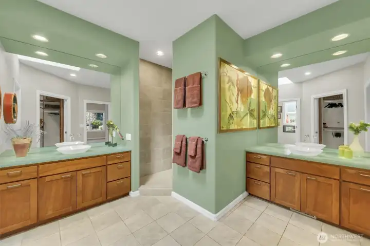 Master bath with walk-in shower, dual vanities, and heated floors