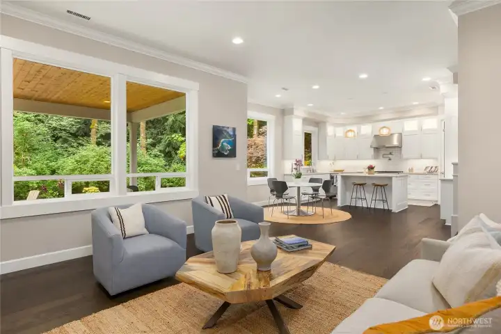 Rich wood floors throughout the home seamlessly connect spaces in this open floorplan