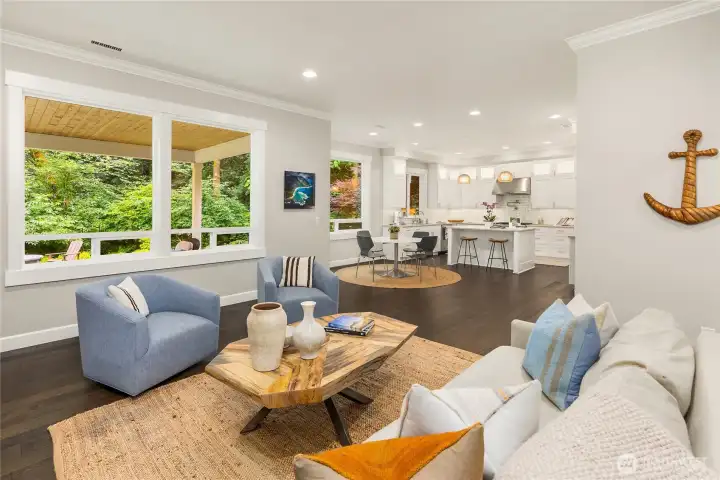Rich wood floors throughout the home seamlessly connect spaces in this open floorplan