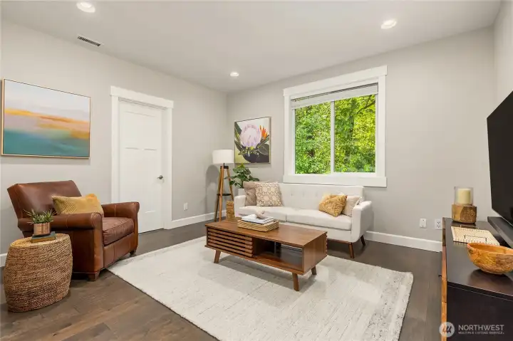 At the top of the stairs is a cozy yet roomy entertainment space