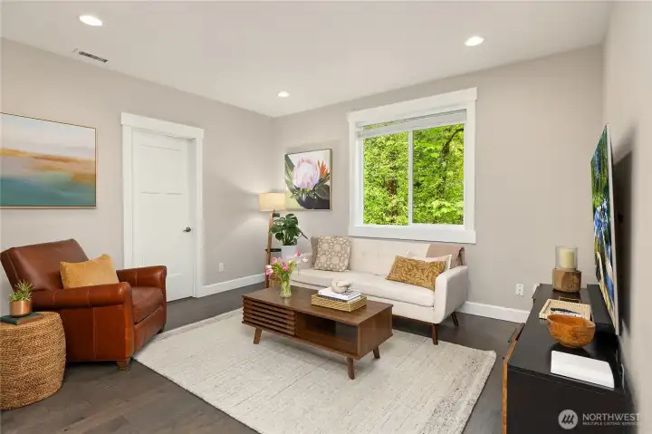 At the top of the stairs is a cozy yet roomy entertainment space