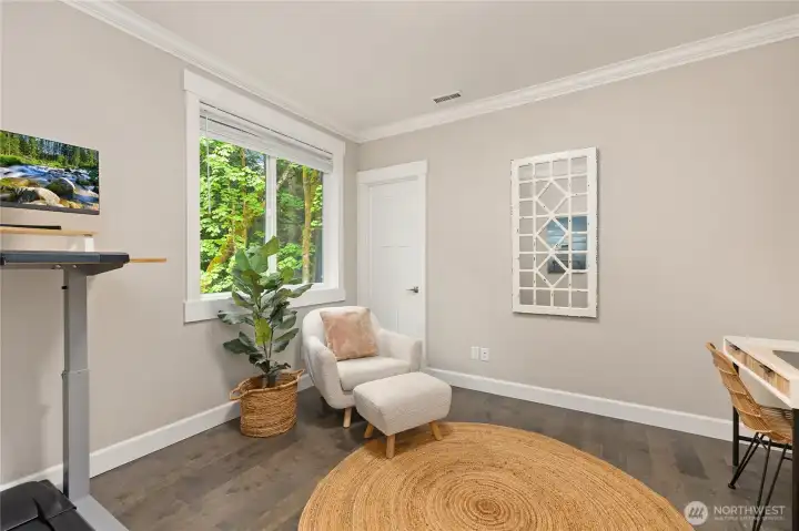 Second of 4 bedrooms, currently used as an office. Door in photo opens to walk in closet