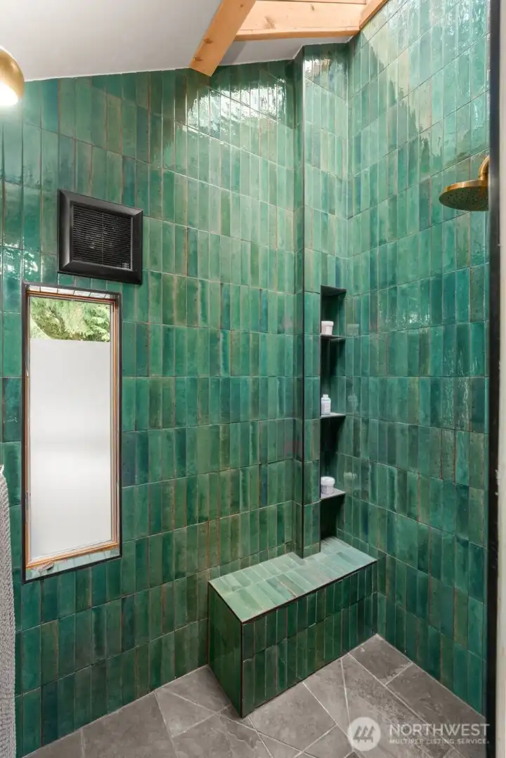 Spa like shower with custom tile & sky light