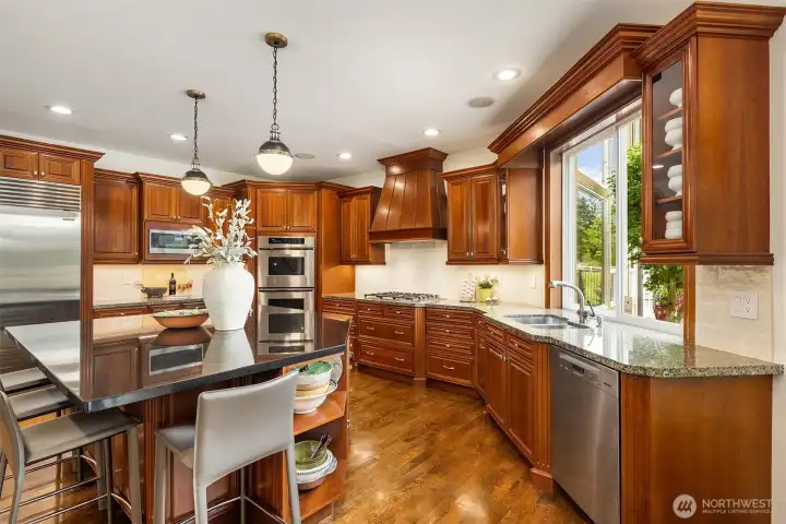 Warm wood floors paired with cherry cabinetry~