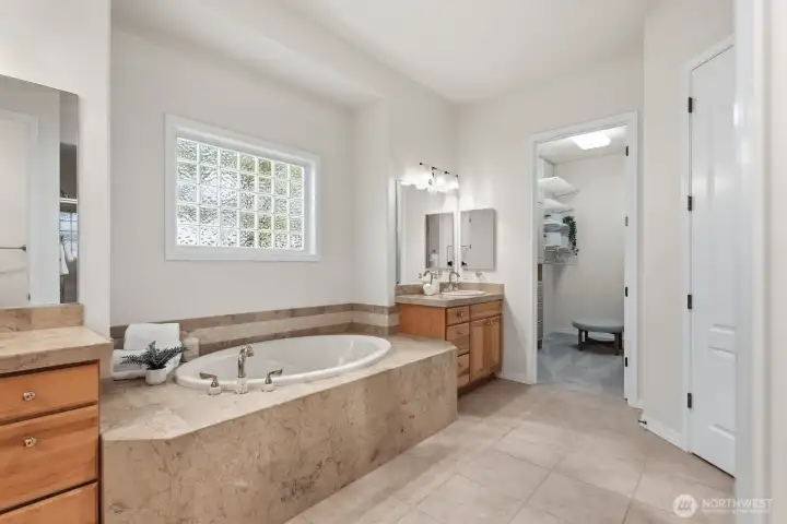 Large primary bath with walk-in closet two sinks and soaking tub Large primary bath with walk-in closet two sinks and soaking tub