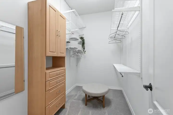 Primary bedroom walk-in closet Primary bedroom walk-in closet