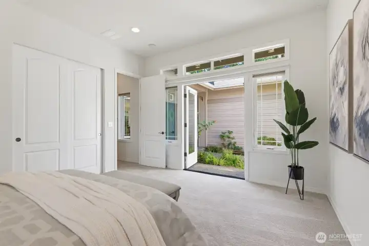 Double doors to the courtyard from the second bedroom Double doors to the courtyard from the second bedroom