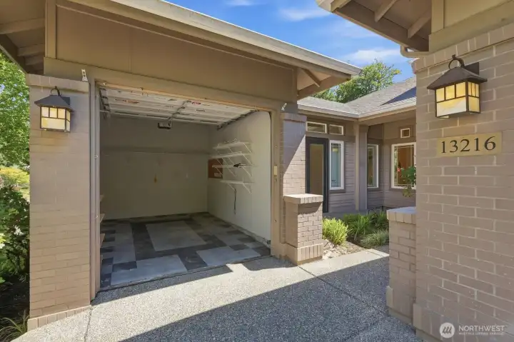 Third garage ideal for a golf cart, workshop, hobby space, home gym, or additional storage Third garage ideal for a golf cart, workshop, hobby space, home gym, or additional storage