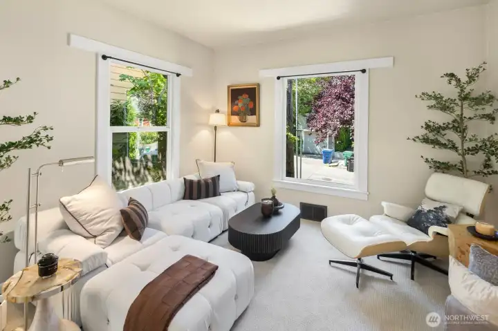 An inviting living room with timeless character, generous natural light, and flexible space to relax, gather, or welcome guests. An inviting living room with timeless character, generous natural light, and flexible space to relax, gather, or welcome guests.