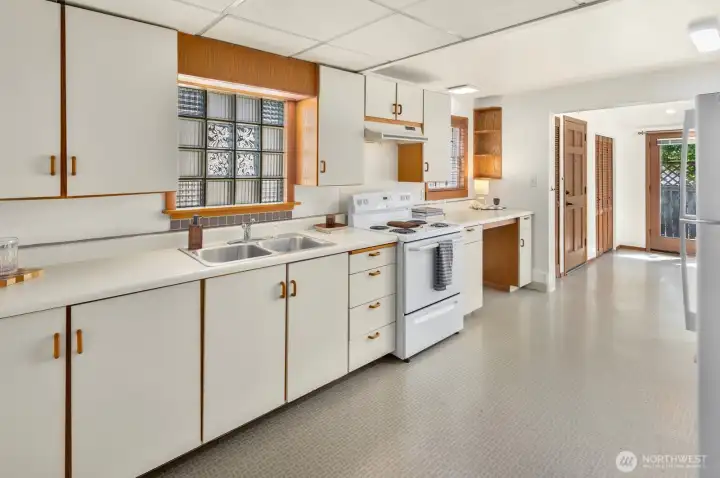 Generous counter space, abundant cabinetry, and an efficient layout make meal preparation simple and enjoyable. Generous counter space, abundant cabinetry, and an efficient layout make meal preparation simple and enjoyable.