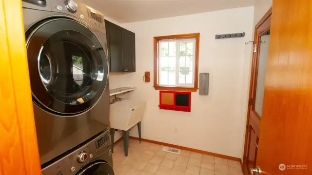 Ample laundry room even has a sweet Dutch door leading to the northeast covered wrap-around deck.