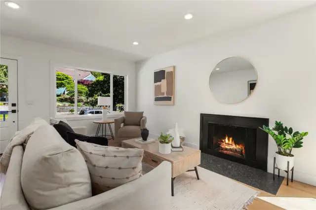 Cozy up to this wood-burning fireplace on those chilly PNW days. Such a beautiful backdrop for this living room.