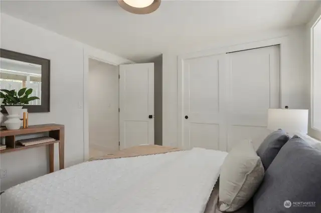 One of two lower level bedrooms offers privacy and adjacent bathroom.