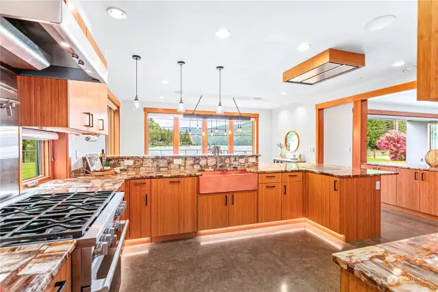 Looking back at the kitchen thru the butler's pantry that features a built-in Thermador freezer