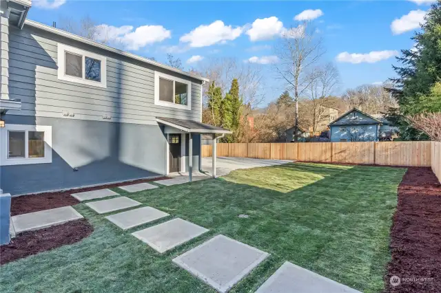 Gorgeous Backyard w/Custom Concrete walk-way, new sod, bark and graveled parking area. New Fencing, as well! Completely move in ready!