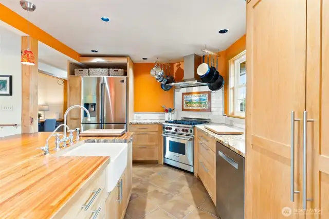 Custom cabinetry, apron sink, butcher block and granite countertops