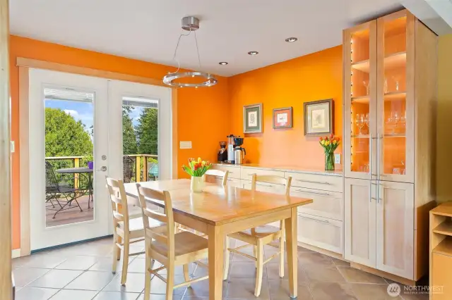 Ample storage in dining room custom cabinet and credenza