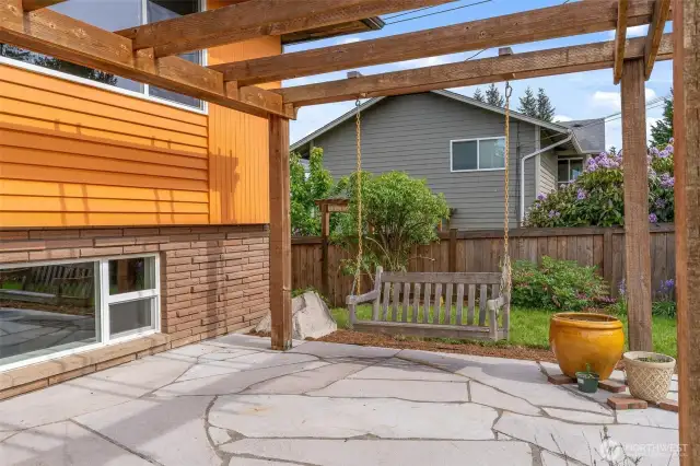 Porch swing for coffee drinking and garden planning