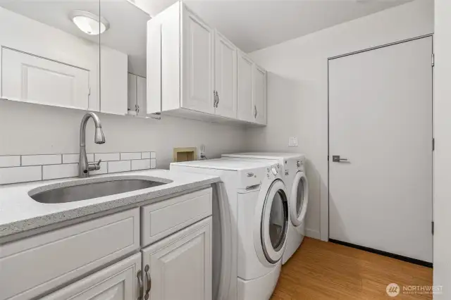 Laundry room with utility sink.