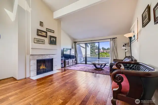A wall of windows floods the room with sunlight and frames tranquil views from the expansive deck.