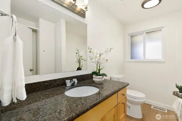 Full bathroom (tub + shower not shown to the right), granite countertop