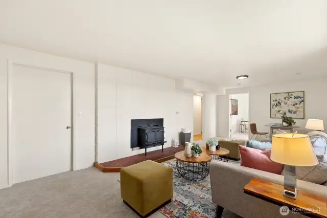 Additional family/living room with wood stove; door to large utility/storage room