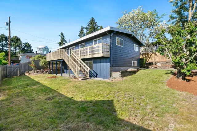 A view of the backyard and the house from the south corner