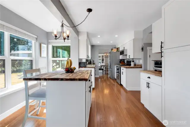 Gorgeous kitchen eating area has large island with extra storage and room to sip that morning coffee.