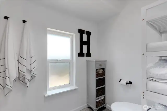 Primary has separate toilet and shower tub combo.  All new!