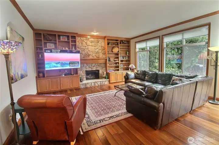 The other half of the Great Room. Built-in Bookcase, rock Fireplace center, just about floor to ceiling windows, 10' ceilings!