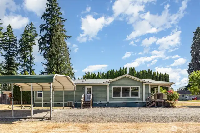 Enjoy a 2-car covered carport with room for extra toys!