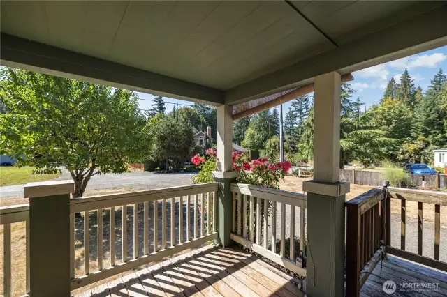Home is complete with a cozy covered front porch that invites you to sit back & relax all year long!
