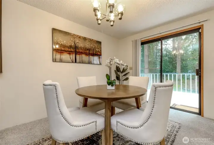 Dinnigroom with access to your spacious deck to enjoy BBQs or drinking a cup of cofee while watching nature in your back yard.