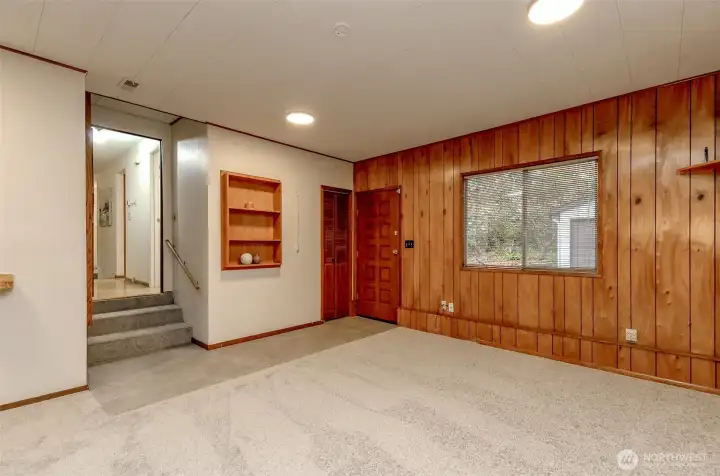 Main floor family room with access from the back garage/shop for easy access.