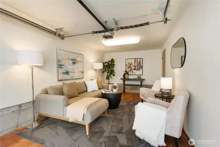 Deep storage closet under stairs contains tankless hot water system.