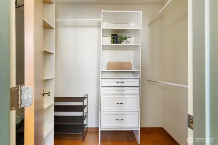 Large walk-in closet offers ample hanging space.