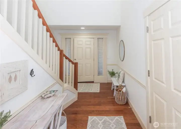 Grand entry with tall ceilings, hardwoods, incricate moldings