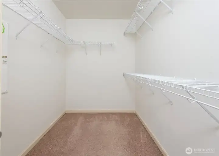 Spacious walk in closet in primary bedroom