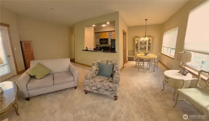 Wide Angle shot of  Living Room, Kitchen and Dining Area.