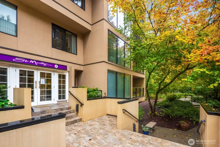 Front entry with tiled terrace and seating area welcoming residents and guests.
