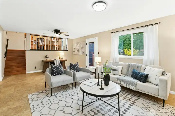 Lower level of this tri-level home is open to the kitchen and dining areas. Its large enough for an office set up and still a generous seating area for movie nights.  It also has it's own connection to the back yard - so perfect!