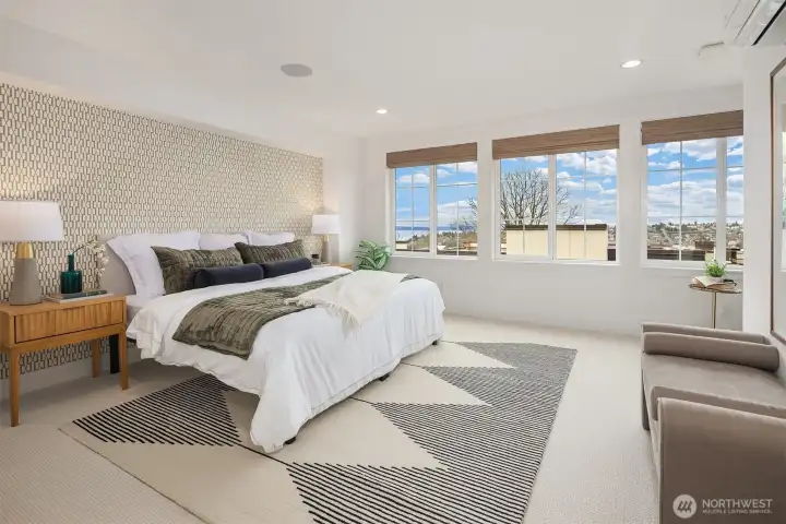 Primary suite with sprawling views of the Olympic Mountain Range and Eliott Bay