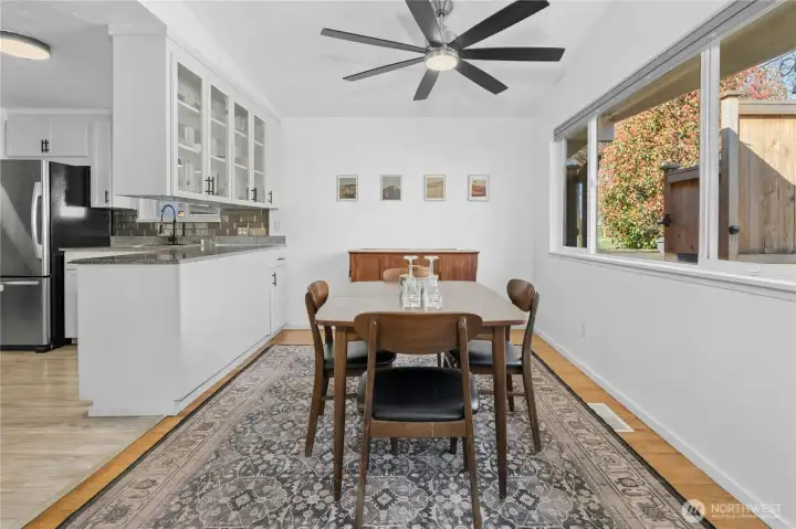 Large dining area perfect for large gatherings and looks into front yard.