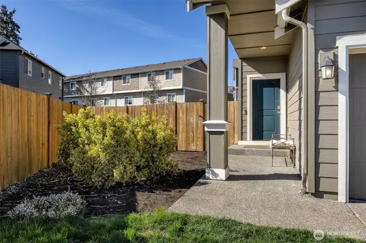 Covered front porch and side yard