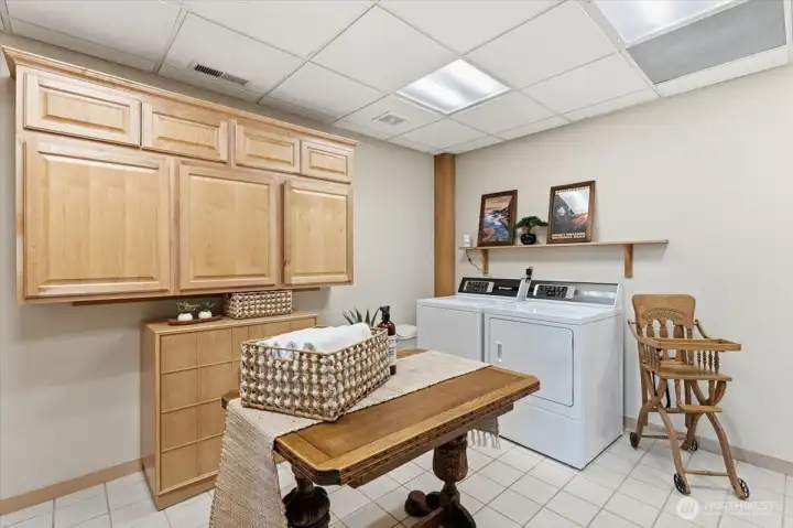 First-floor laundry room with abundant, thoughtfully designed storage.