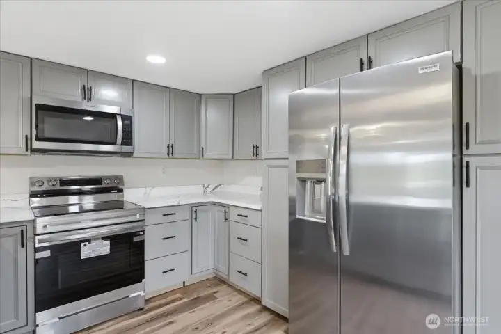 Kitchen w/ Stainless steel appliances