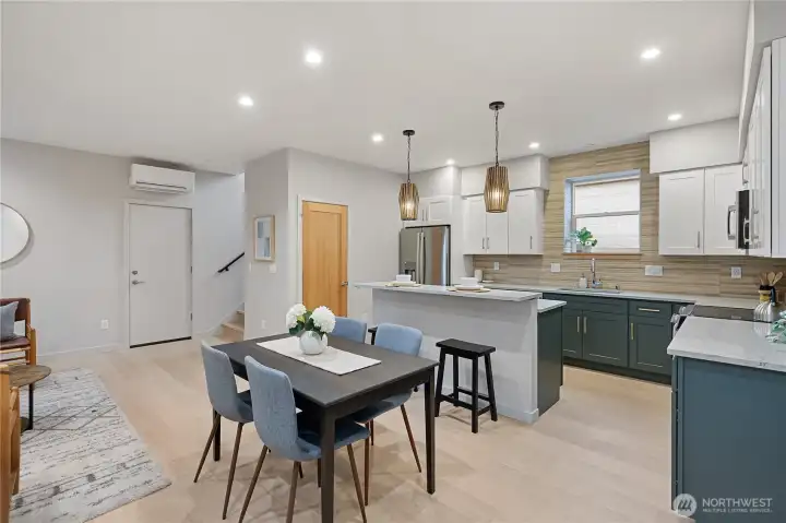 Enter into the main floor and be greeted by the bright kitchen.